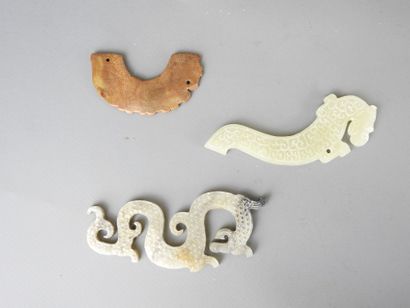 Three jade motifs (chimera or dragon). L...