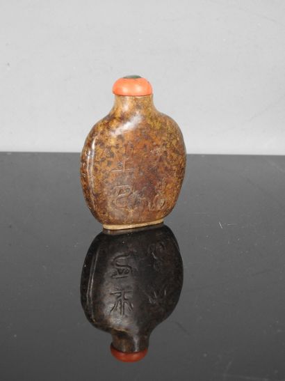 CHINA - 19th century
Flat-shaped brown jade...
