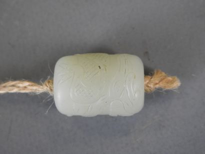 Jade pendant carved with a dragon. Height:...