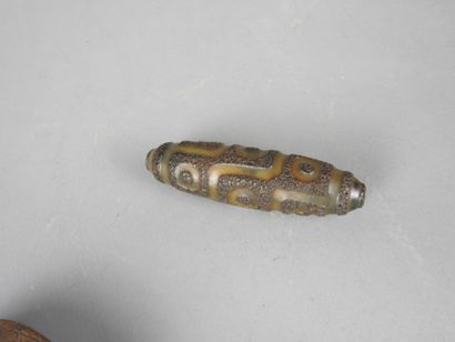 TIBET: DZI resin amulet. L: 7 cm. 
A small...