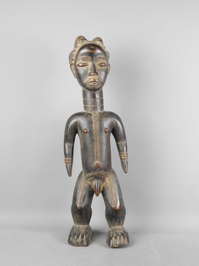 Ivory Coast. Hard wood with black-brown patina....