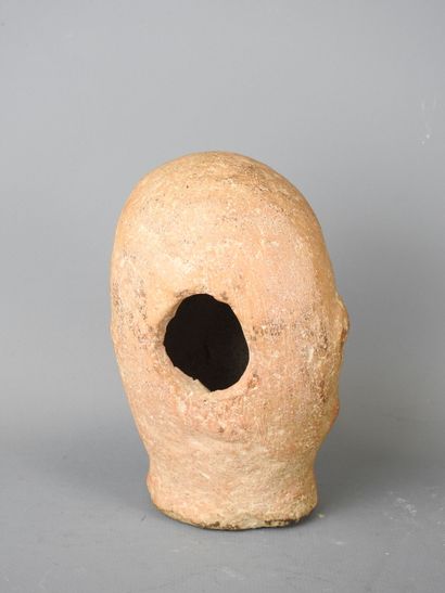 Carthaginian-style baked head of a man with...