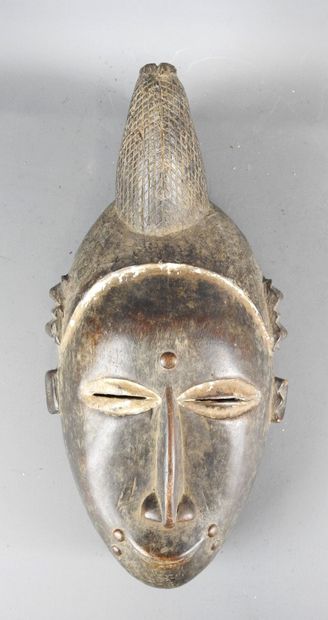 Baule Ivory Coast. Dance mask featuring a...