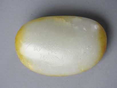 CHINA: Nephrite jade pebble with engraved...