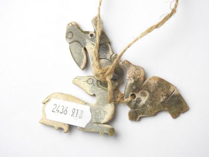 CHINA: Three carved stone pendants in the...