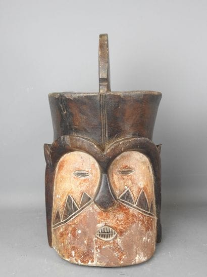 NIGERIA: Wood and pigment mask depicting...
