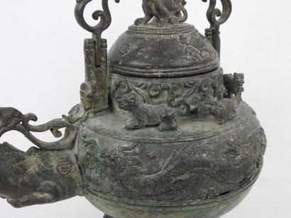 Bronze ritual kettle decorated with animals....
