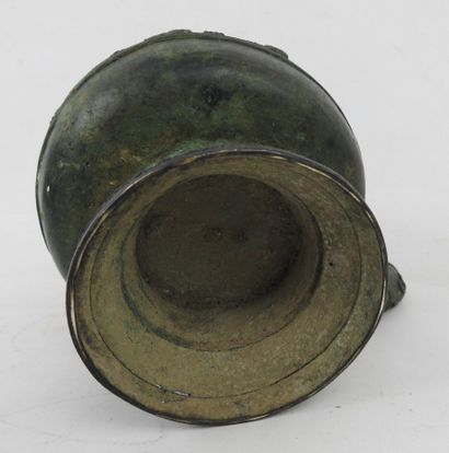Bronze ritual kettle decorated with animals....