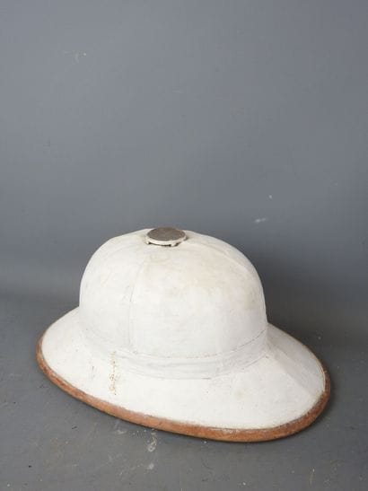 White colonial helmet with brown piping....