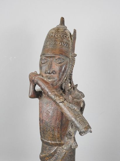 BENIN: Statue of a messenger blowing into...