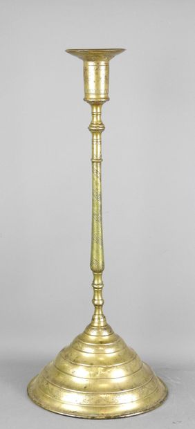 ORIENT: Gilt bronze candlestick with incised...