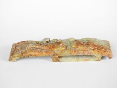 CHINA: Carved stone belt buckle decorated...