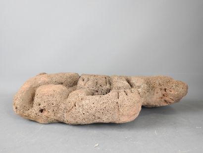 MEXICO CITY: Lava stone statue of a stylized...