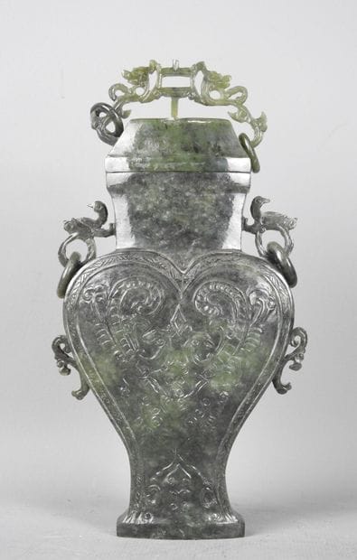 CHINA: Spinach-green jadeite stone covered...