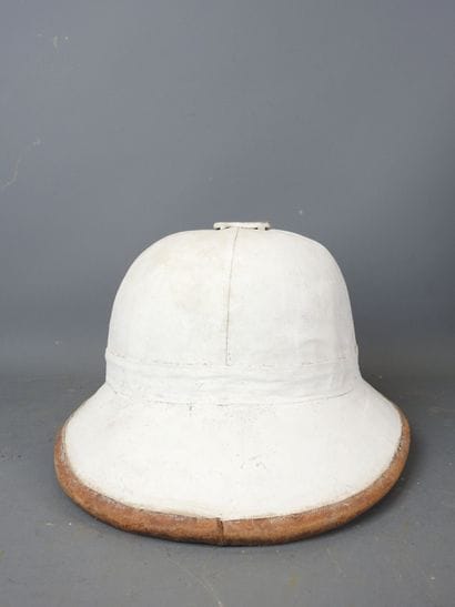 White colonial helmet with brown piping....