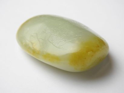 CHINA: Nephrite jade pebble with engraved...