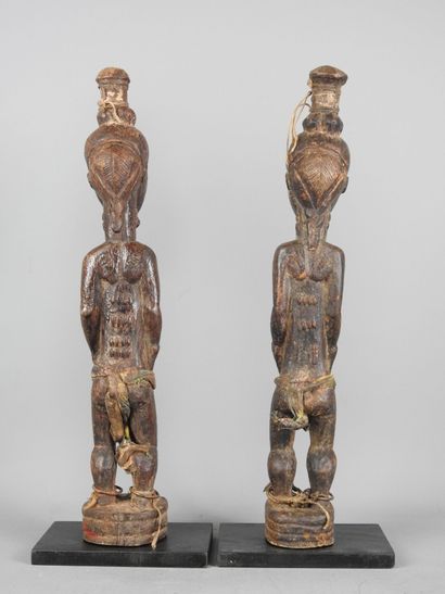 Baule Ivory Coast: Two carved wooden statues...