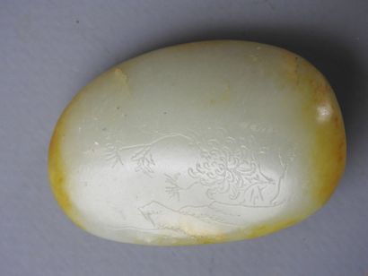 CHINA: Nephrite jade pebble with engraved...