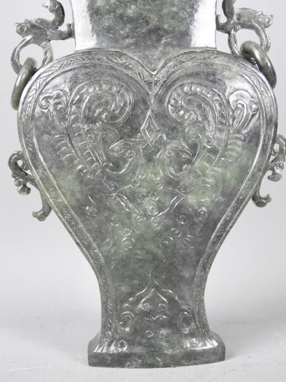 CHINA: Spinach-green jadeite stone covered...