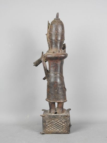 BENIN: Statue of a messenger blowing into...