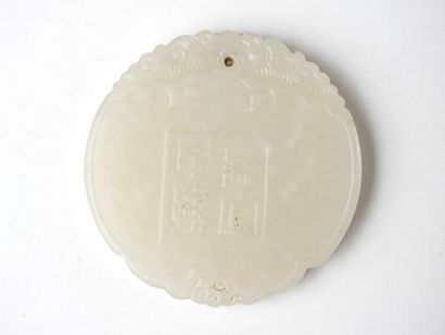 CHINA: Circular jade pendant with calligraphy...