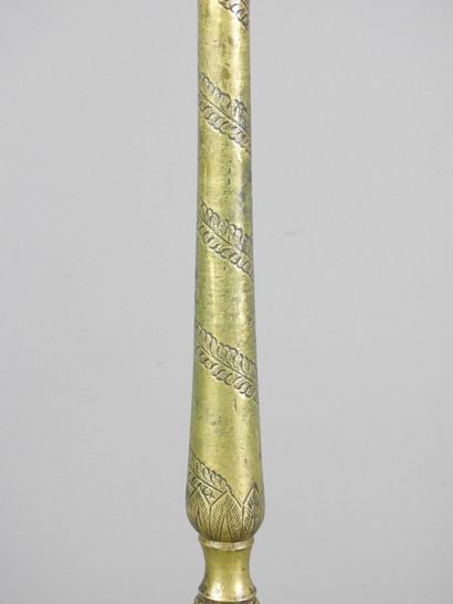 ORIENT: Gilt bronze candlestick with incised...