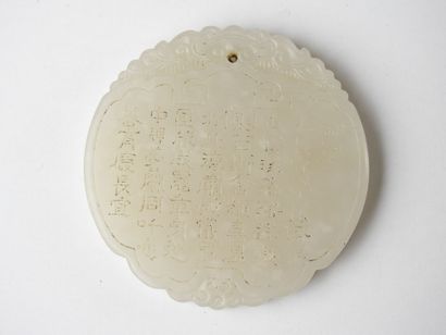 CHINA: Circular jade pendant with calligraphy...
