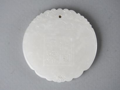 CHINA: Circular jade pendant with calligraphy...