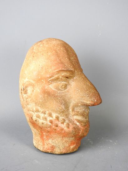 Carthaginian-style baked head of a man with...