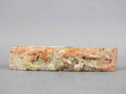 CHINA: Carved stone belt buckle decorated...