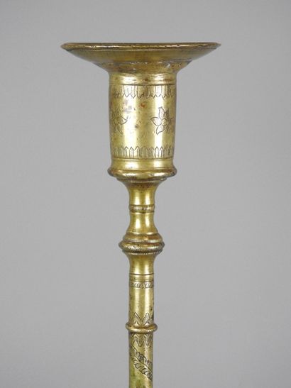 ORIENT: Gilt bronze candlestick with incised...