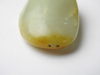 CHINA: Nephrite jade pebble with engraved...