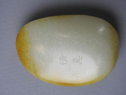 CHINA: Nephrite jade pebble with engraved...