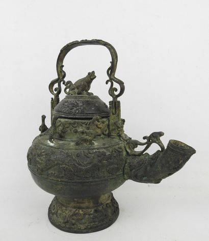 Bronze ritual kettle decorated with animals....