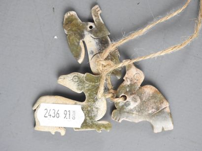 CHINA: Three carved stone pendants in the...