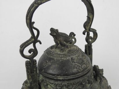 Bronze ritual kettle decorated with animals....