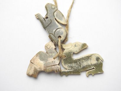 CHINA: Three carved stone pendants in the...