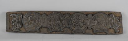 TIBET: Wooden xylographic board used to print...
