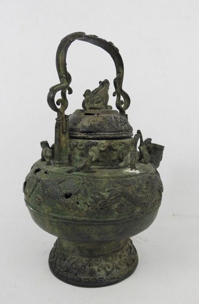 Bronze ritual kettle decorated with animals....