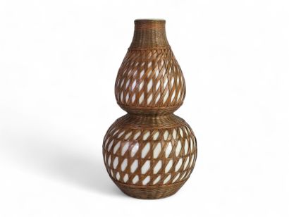 Porcelain and woven bamboo double gourd vase....