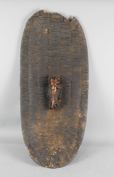 Wooden war shield covered with a fine fiber...