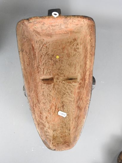 GABON: Wooden mask with ochre and black pigments,...