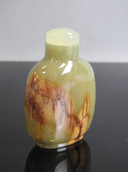 CHINA - Circa 1900
Celadon and brown jade...