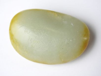 CHINA: Nephrite jade pebble with engraved...