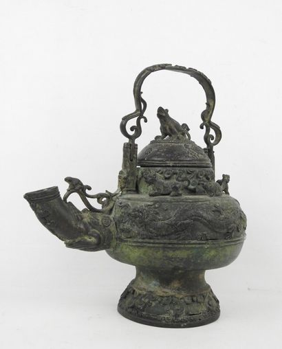 Bronze ritual kettle decorated with animals....