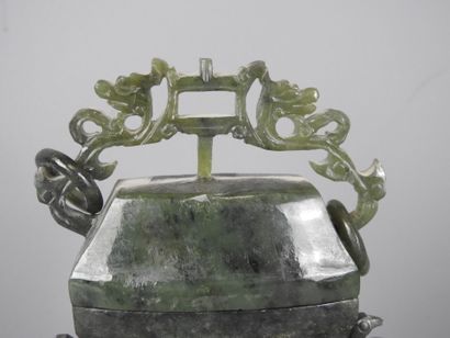 CHINA: Spinach-green jadeite stone covered...