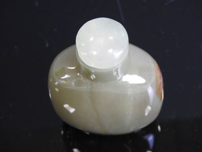 CHINA - Circa 1900
Celadon and brown jade...