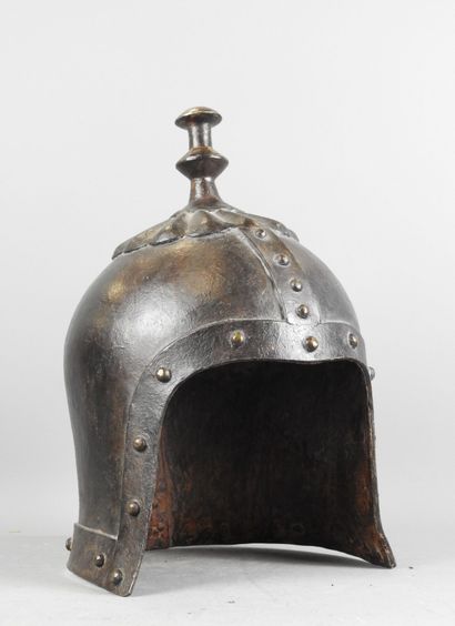 CHINA. Fancy helmet in patinated iron with...