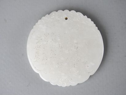 CHINA: Circular jade pendant with calligraphy...