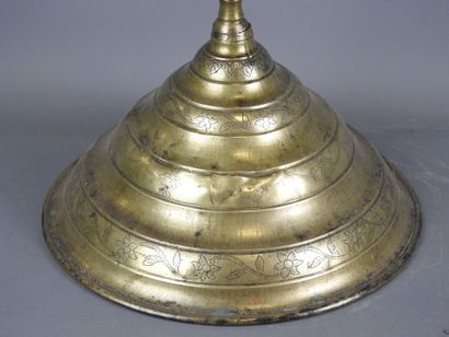 ORIENT: Gilt bronze candlestick with incised...